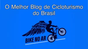 Logo do Bike no Ar com silhueta de ciclista alado fazendo um wheelie, sobre fundo azul, com os textos 'O Melhor Blog de Cicloturismo do Brasil' e 'BIKE NO AR'.